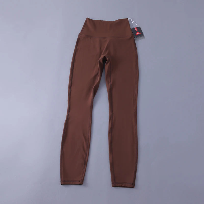 Women's high-waisted yoga pants with sculpting peach lift, buttery soft fabric for running and training.