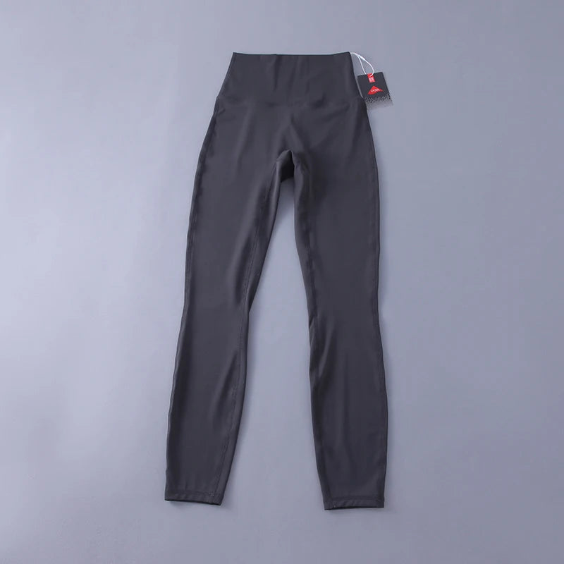 Women's high-waisted yoga pants with sculpting peach lift, buttery soft fabric for running and training.